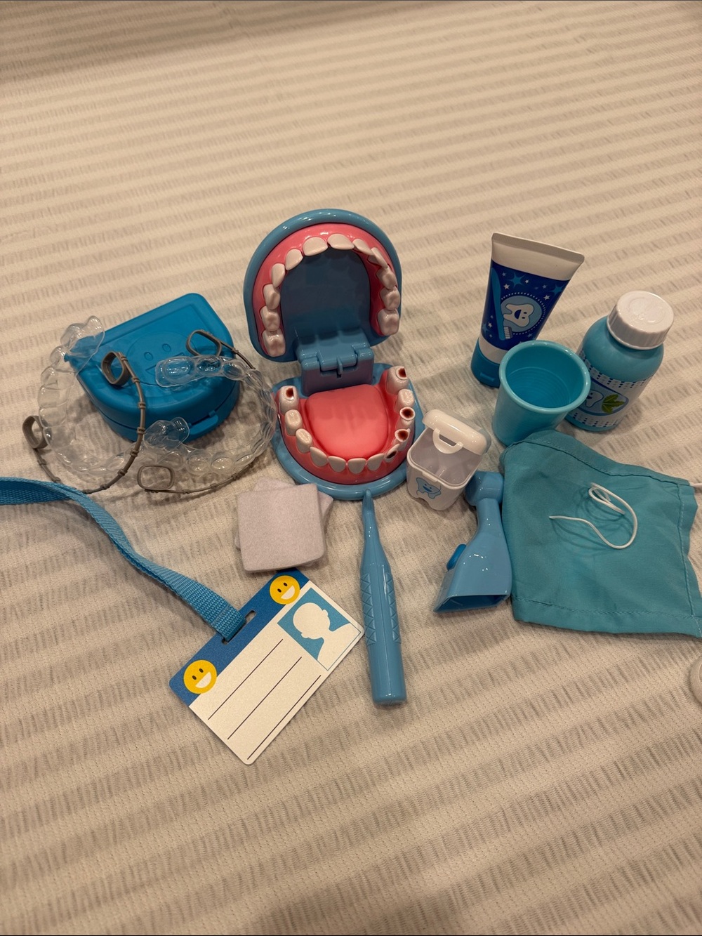 Melissa & Doug Blue Dental Playset with teeth braces and dental instruments